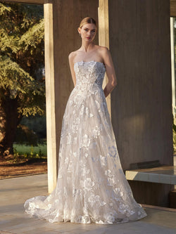 Woman wearing a strapless floral gown outdoors, Lace princess strapless wedding dress pronoias MENTA