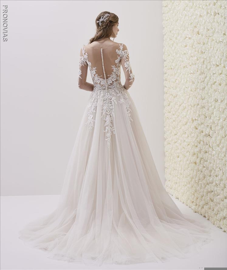 Wedding dress in embroidered tulle fabric with A-line cut  illusion back