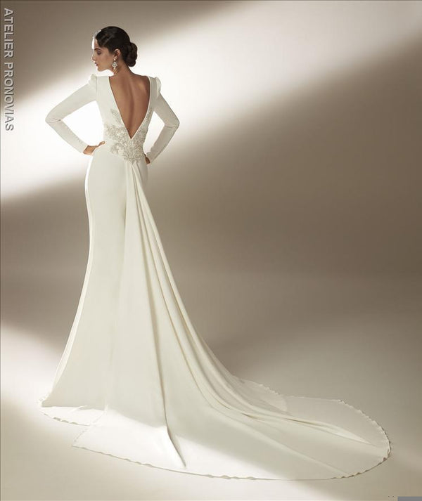 Mermaid wedding dress with bateau neckline and long sleeves in crepe back embroidery