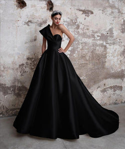 Pronovias Tourmaline black dress with princess cut, asymmetrical neckline and cap sleeves
